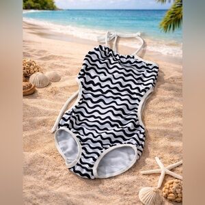 Fancy Schmancy Swim Suit. No size tag. We wore at 3-4t. Great Condition